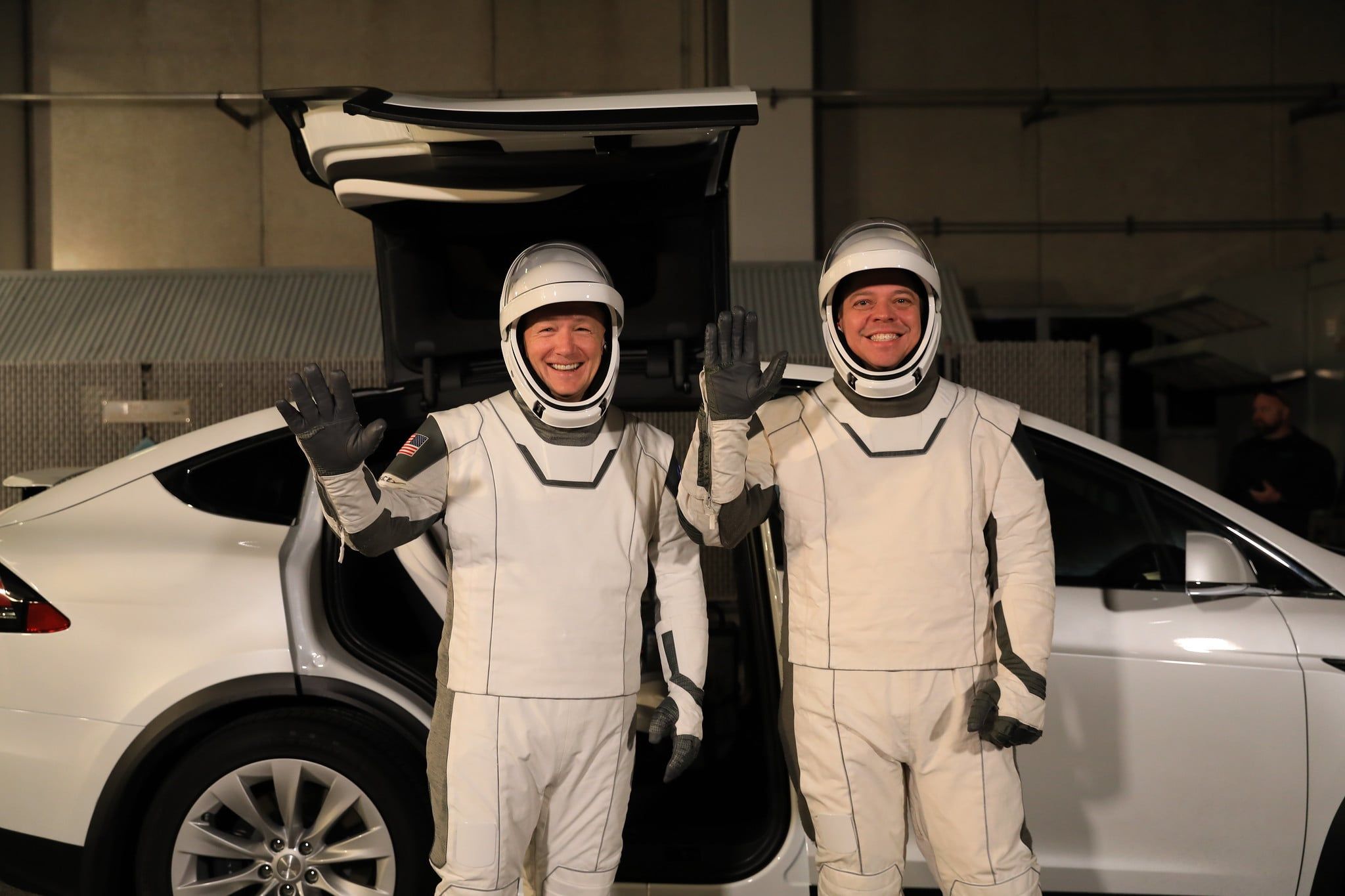 Hurley (left) and Behnken (right) boarding the Model X Astrovan